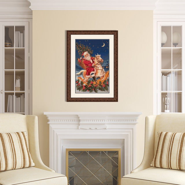 Santa on a Rocking Horse Cross Stitch Pattern